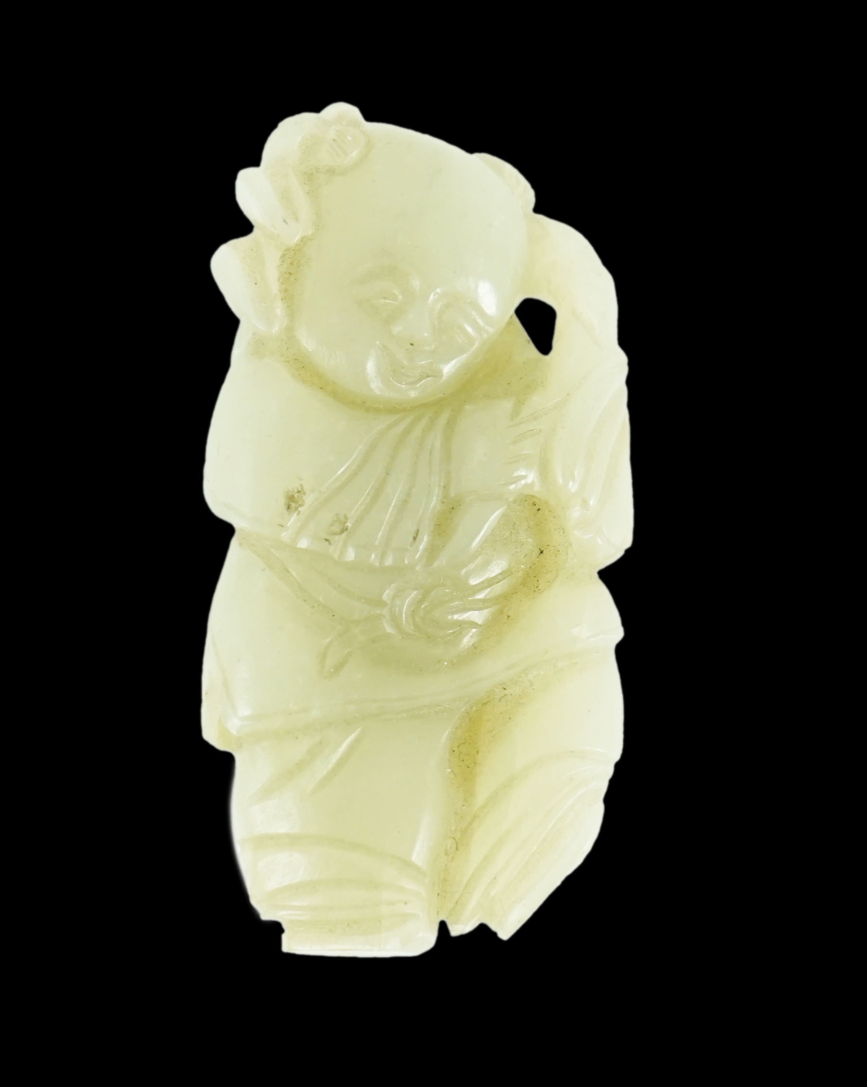 A Chinese celadon jade figure of a boy holding a lotus sprig, 19th century 5.2 cm high